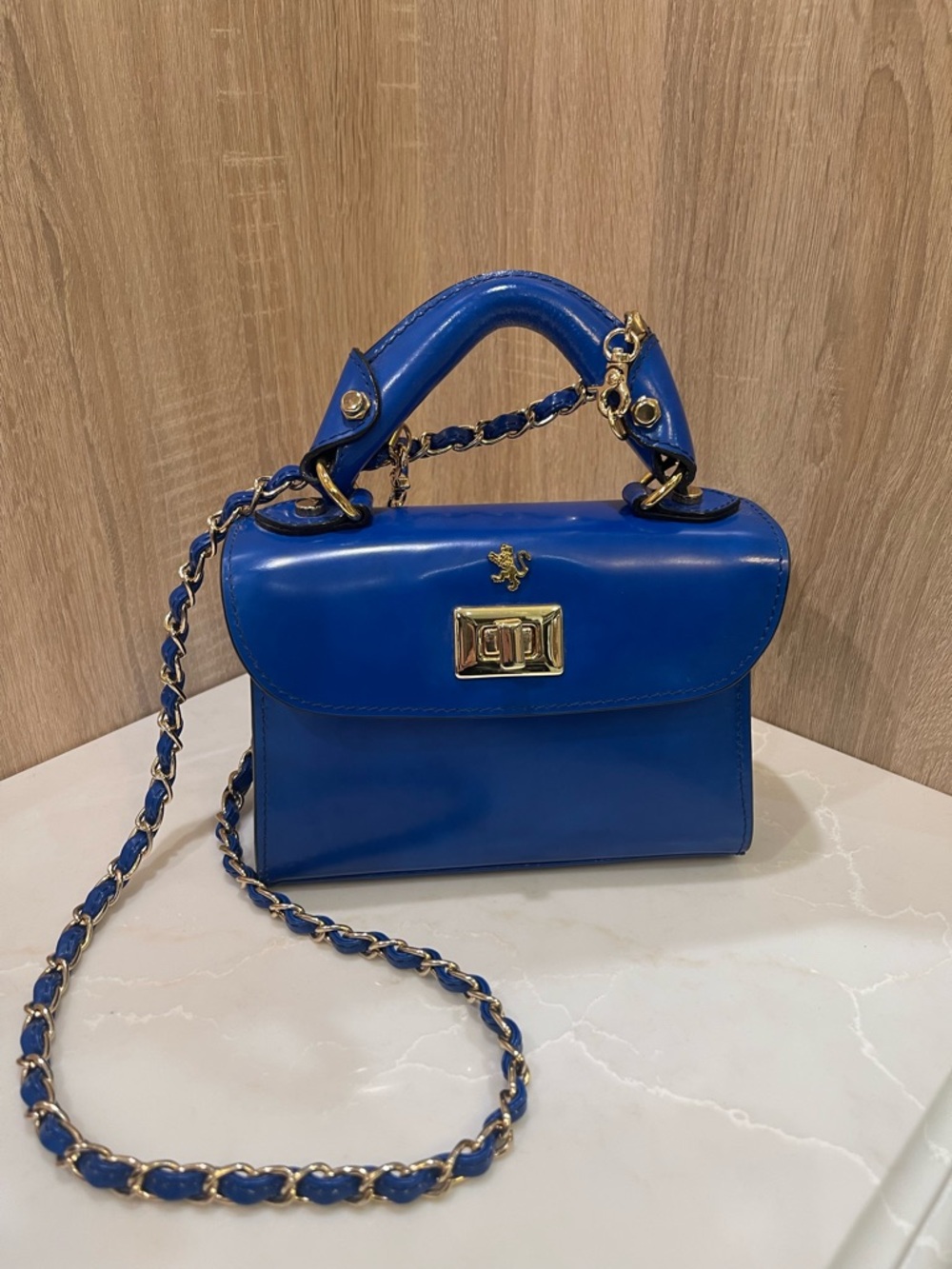 Structured Blue Leather Top-Handle Satchel with Gold Chain Strap